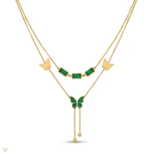 Gold layered necklace with green stones and butterfly pendant.