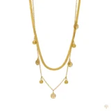 Layered gold necklace with flat herringbone chain and tree of life charms.