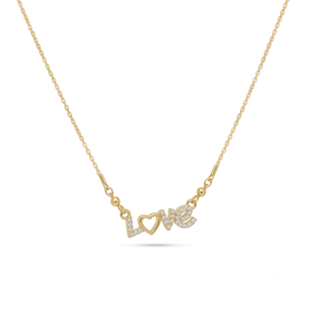 Gold script necklace spelling "Love" with a paved crystal heart as the letter O.
