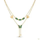Gold layered necklace with green stones and butterfly pendant.