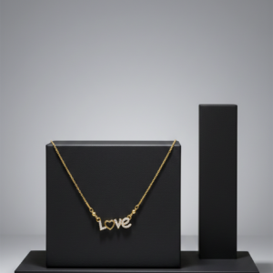 Gold chain necklace featuring a diamond-encrusted "LOVE" pendant with a heart-shaped "O" on a black display stand.