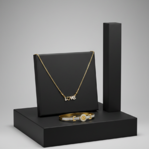 A gold necklace with a diamond-encrusted LOVE pendant and a matching gold bangle on black display stands