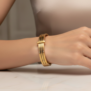 Legacy Sphere Gold Stainless Steel Handcuff Bracelet with screw motifs and stones.