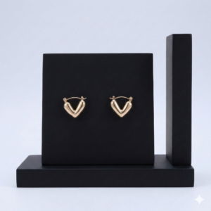 Minimalist V-shaped puffy heart hoop earrings in 18K gold plated stainless steel.