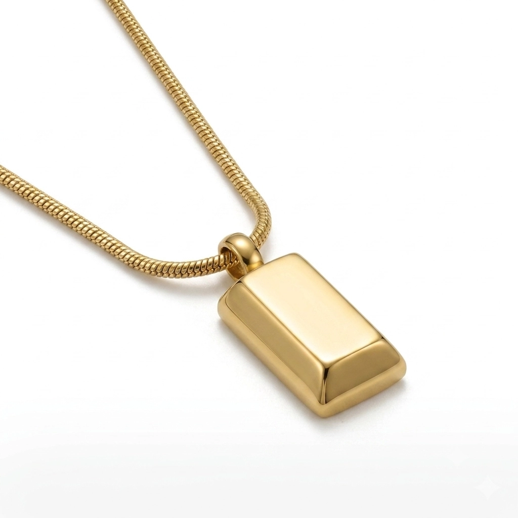 Close-up of a gold bar pendant on a thick snake chain.